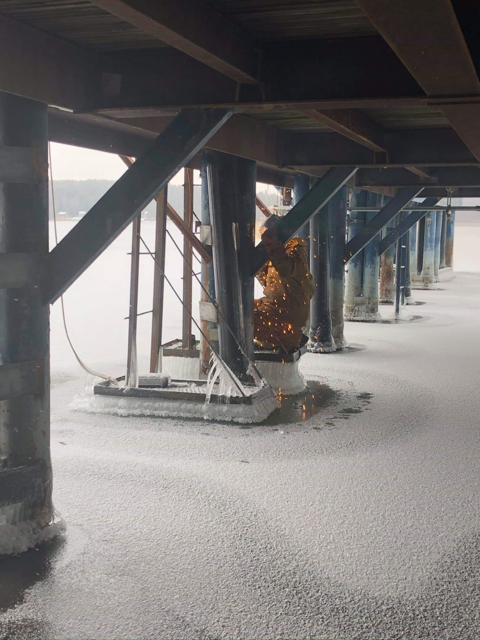 IMG_5958 Large Excavator bucket dropping dirt into an open trench.