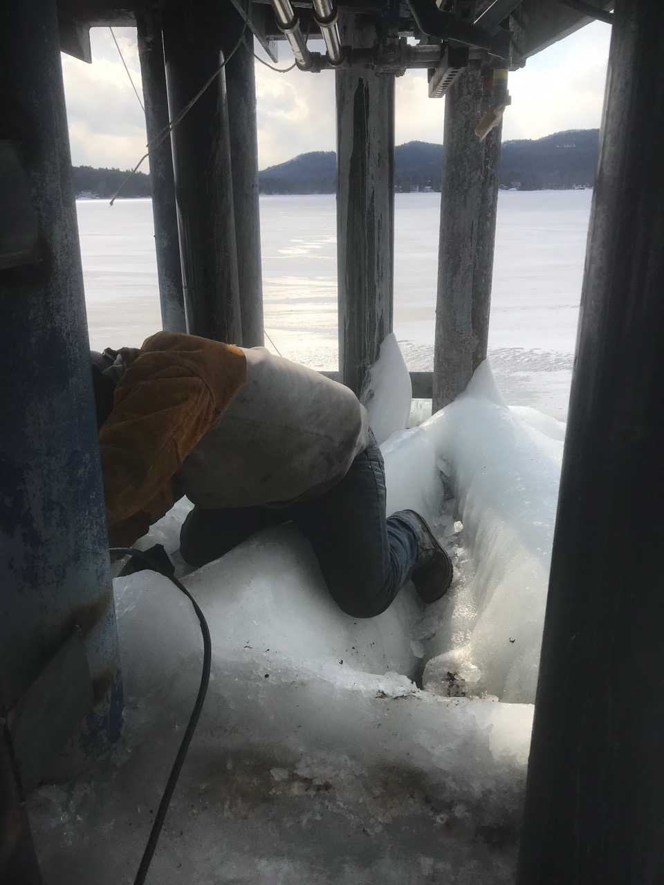 IMG_6027 Large Excavator bucket dropping dirt into an open trench.